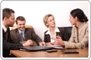 Image of a UK professional formation agents sitting in meeting room with a foreign client, illustrating the concept of helping people to start & forming a business in the UK.